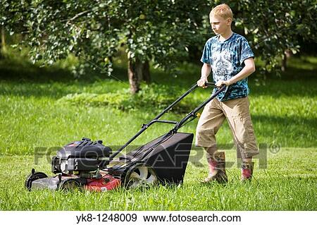 Teenage Boy Mowing Lawn Using Lawn Mower View Large Photo Image Stock Photo - Teenage Boy Mowing Lawn Using Lawn Mower. Fotosearch