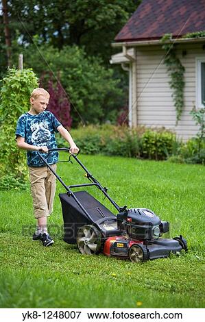 Teenage Boy Mowing Lawn Using Lawn Mower. View Large Photo Image Stock Photo - Teenage Boy Mowing Lawn Using Lawn Mower.. Fotosearch