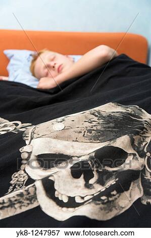Stock Photo - Teenage Boy Sleeping in Bed. Fotosearch