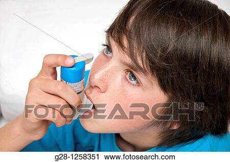 teenage boy treating his asthma by inhaling View Large Photo Image Stock Image - teenage boy treating his asthma by inhaling. Fotosearch
