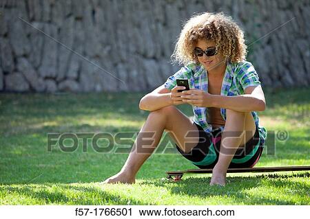 Teenage boy using his smart phone View Large Photo Image Stock Image - Teenage boy using his smart phone. Fotosearch