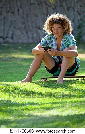 Teenage boy using his smart phone View Large Photo Image Stock Image - Teenage boy using his smart phone. Fotosearch