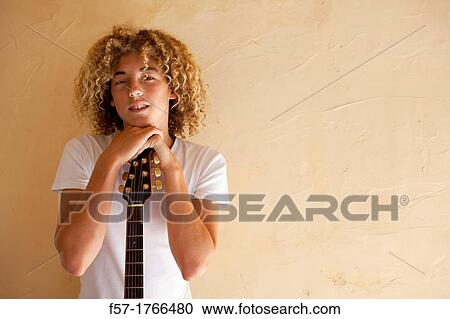 Teenage boy with his guitar View Large Photo Image Stock Image - Teenage boy with his guitar. Fotosearch