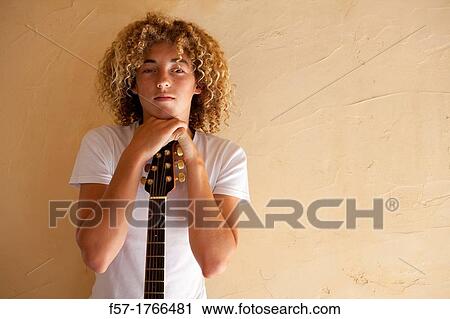 Teenage boy with his guitar View Large Photo Image Stock Image - Teenage boy with his guitar. Fotosearch