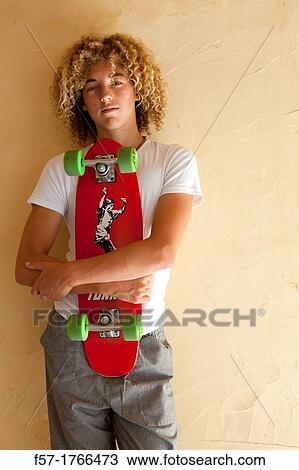 Teenage boy with his longboard View Large Photo Image Stock Image - Teenage boy with his longboard. Fotosearch