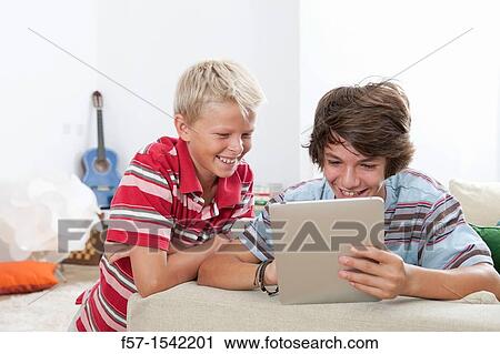 Teenage boys with Tablet View Large Photo Image Stock Image - Teenage boys with Tablet. Fotosearch