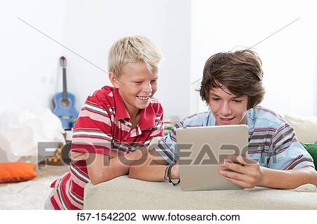 Teenage boys with Tablet View Large Photo Image Stock Image - Teenage boys with Tablet. Fotosearch