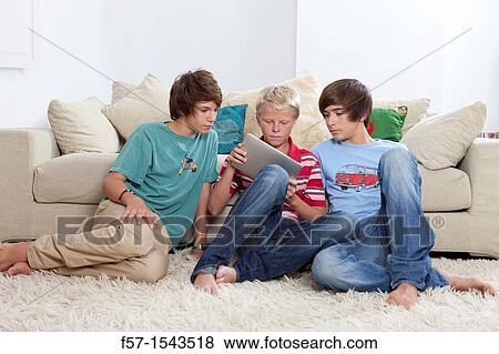 Teenage boys with Tablet View Large Photo Image Stock Photo - Teenage boys with Tablet. Fotosearch