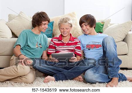 Teenage boys with Tablet View Large Photo Image Stock Photo - Teenage boys with Tablet. Fotosearch
