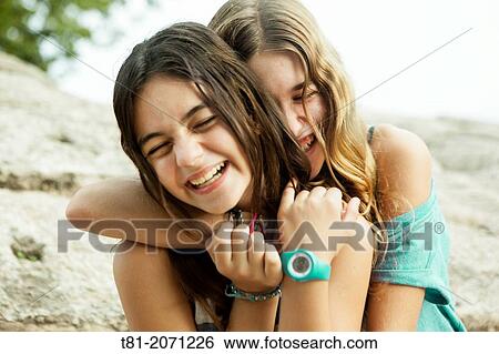 Teenage friends hugging. Valencia, Spain View Large Photo Image Stock Photograph - Teenage friends hugging. Valencia, Spain. Fotosearch