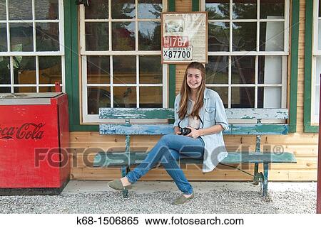 Stock Photography - teenage girl, 15, at the museum in Pincher Creek, Alberta, Canada. Fotosearch