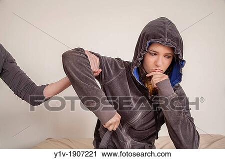 Stock Image - Teenage girl and her mother's arm. Fotosearch