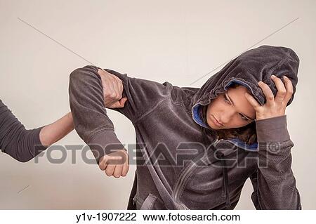 Stock Image - Teenage girl and her mother's arm. Fotosearch