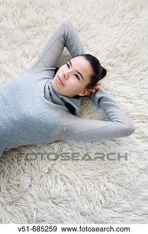 Teenage girl daydreaming at home View Large Photo Image Stock Photo - Teenage girl daydreaming at home. Fotosearch