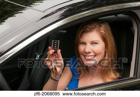 Teenage girl happy to be driving and finally getting her drivers license in first car. View Large Photo Image Stock Photography - Teenage girl happy to be driving and finally getting her drivers license in first car.. Fotosearch
