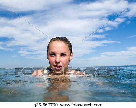 Teenage girl in ocean water. View Large Photo Image Stock Image - Teenage girl in ocean water.. Fotosearch