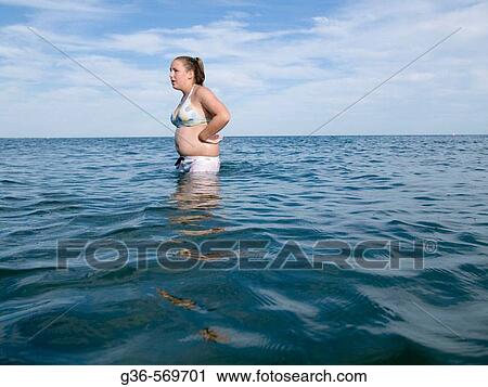 Teenage girl in ocean water. View Large Photo Image Stock Image - Teenage girl in ocean water.. Fotosearch