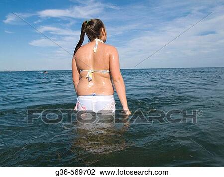 Teenage girl in ocean water. View Large Photo Image Stock Image - Teenage girl in ocean water.. Fotosearch