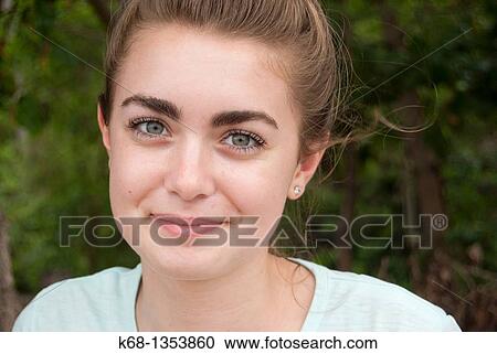 Stock Image - teenage girl on holiday at the beach in the tropics. Fotosearch