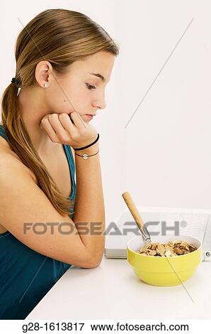 Teenage girl refusing to eat her cereals suffering from anorexia View Large Photo Image Stock Photo - Teenage girl refusing to eat her cereals suffering from anorexia. Fotosearch