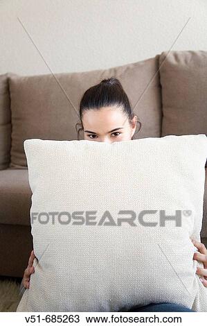 Teenage girl sitting on the livingroom smiling View Large Photo Image Stock Image - Teenage girl sitting on the livingroom smiling. Fotosearch