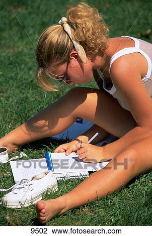Teenage girl studying on campus View Large Photo Image Stock Image - Teenage girl studying on campus. Fotosearch