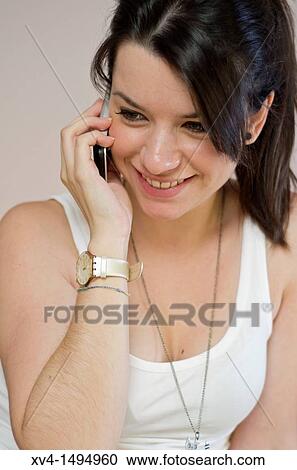 Teenage girl talking on her mobile phone View Large Photo Image Stock Image - Teenage girl talking on her mobile phone. Fotosearch