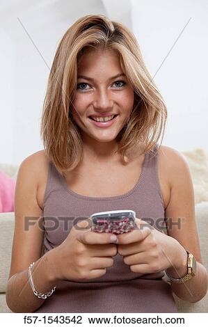 Teenage girl texting on her Blackberry? s View Large Photo Image Stock Image - Teenage girl texting on her Blackberry? s. Fotosearch