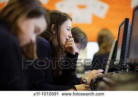 Teenage girl using information technology computer in class, secondary school, Wales UK View Large Photo Image Stock Image - Teenage girl using information technology computer in class, secondary school, Wales UK. Fotosearch