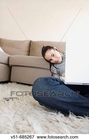 Teenage girl using technologies and looking at camera View Large Photo Image Stock Photo - Teenage girl using technologies and looking at camera. Fotosearch