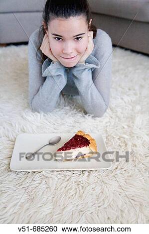 Teenage girl wanting to eat a cake View Large Photo Image Stock Image - Teenage girl wanting to eat a cake. Fotosearch