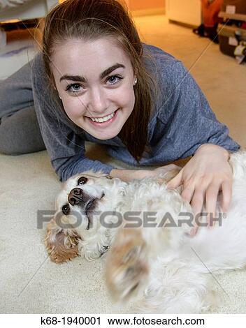 Teenage girl with her dog, a cocker spaniel View Large Photo Image Stock Image - Teenage girl with her dog, a cocker spaniel. Fotosearch