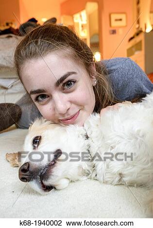 Teenage girl with her dog, a cocker spaniel View Large Photo Image Stock Image - Teenage girl with her dog, a cocker spaniel. Fotosearch