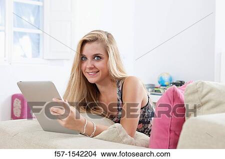 Teenage girl with tablet View Large Photo Image Picture - Teenage girl with tablet. Fotosearch