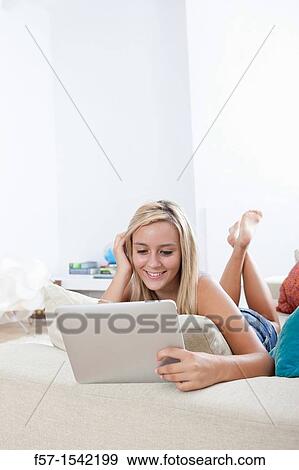 Teenage girl with tablet View Large Photo Image Stock Photo - Teenage girl with tablet. Fotosearch