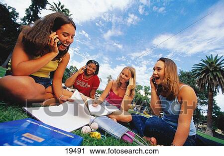 Teenage girls on cell phones View Large Photo Image Stock Image - Teenage girls on cell phones. Fotosearch
