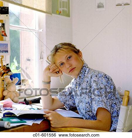 Teenage girl's portrait a desk View Large Photo Image Stock Photograph - Teenage girl's portrait a desk. Fotosearch