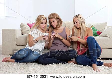Teenage girls texting on their Blackberry? s View Large Photo Image Stock Image - Teenage girls texting on their Blackberry? s. Fotosearch