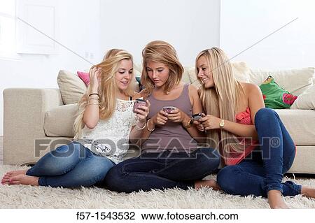 Teenage girls texting on their Blackberry? s View Large Photo Image Stock Image - Teenage girls texting on their Blackberry? s. Fotosearch