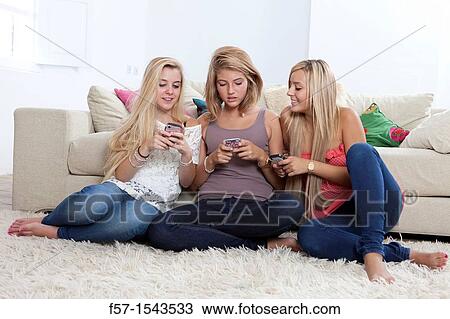 Teenage girls texting on their Blackberry? s View Large Photo Image Stock Image - Teenage girls texting on their Blackberry? s. Fotosearch