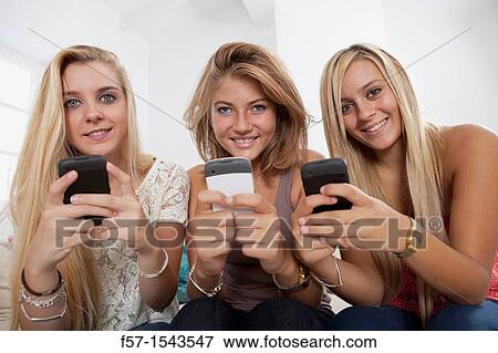 Teenage girls texting on their Blackberry? s View Large Photo Image Stock Photo - Teenage girls texting on their Blackberry? s. Fotosearch