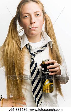 Teenage schoolgirl wearing school uniform smoking cigarette and drinking a can of cider View Large Photo Image Stock Photograph - Teenage schoolgirl wearing school uniform smoking cigarette and drinking a can of cider. Fotosearch