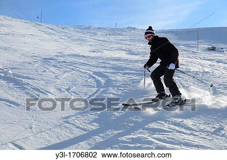 Teenage skier sliding on snowy slopes, French Alps, France View Large Photo Image Stock Image - Teenage skier sliding on snowy slopes, French Alps, France. Fotosearch