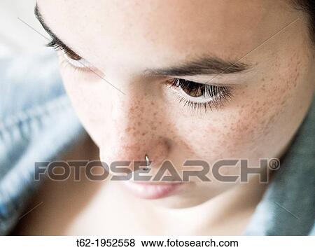 Teenage very thoughtful. Close up of the face. View Large Photo Image Stock Photo - Teenage very thoughtful. Close up of the face.. Fotosearch