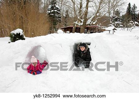 Teenager Boy and His Sister in Snow Cave View Large Photo Image Picture - Teenager Boy and His Sister in Snow Cave. Fotosearch