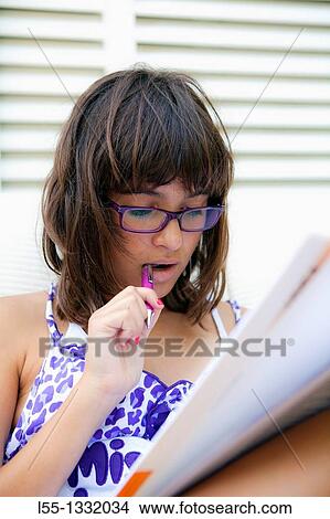 Picture - Teenager doing homework. Fotosearch