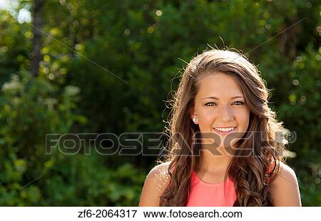 Teenager girl clean makeup smile outdoors seventeen beauty face in sunshine backlit happy teen with great hair. View Large Photo Image Stock Photo - Teenager girl clean makeup smile outdoors seventeen beauty face in sunshine backlit happy teen with great hair.. Fotosearch