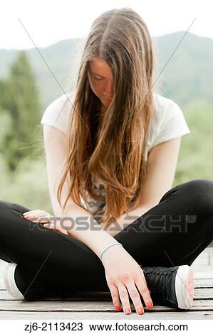 Teenager girl sitting on decking. View Large Photo Image Stock Image - Teenager girl sitting on decking.. Fotosearch