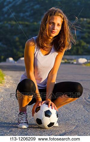 Stock Photo - Teenager girl with a ball. Fotosearch