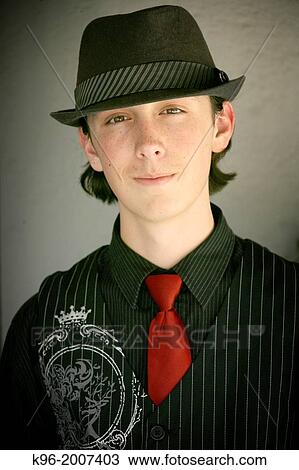 Teenager in fedora hat and red tie View Large Photo Image Stock Image - Teenager in fedora hat and red tie. Fotosearch